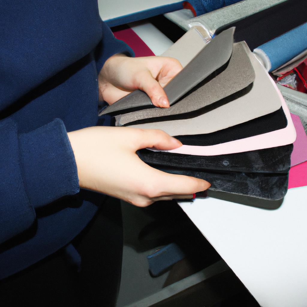 Person working with fabric samples
