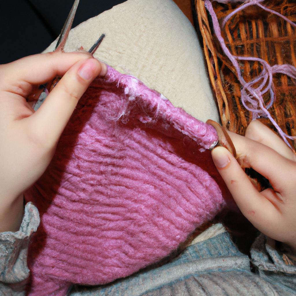Person knitting with yarn
