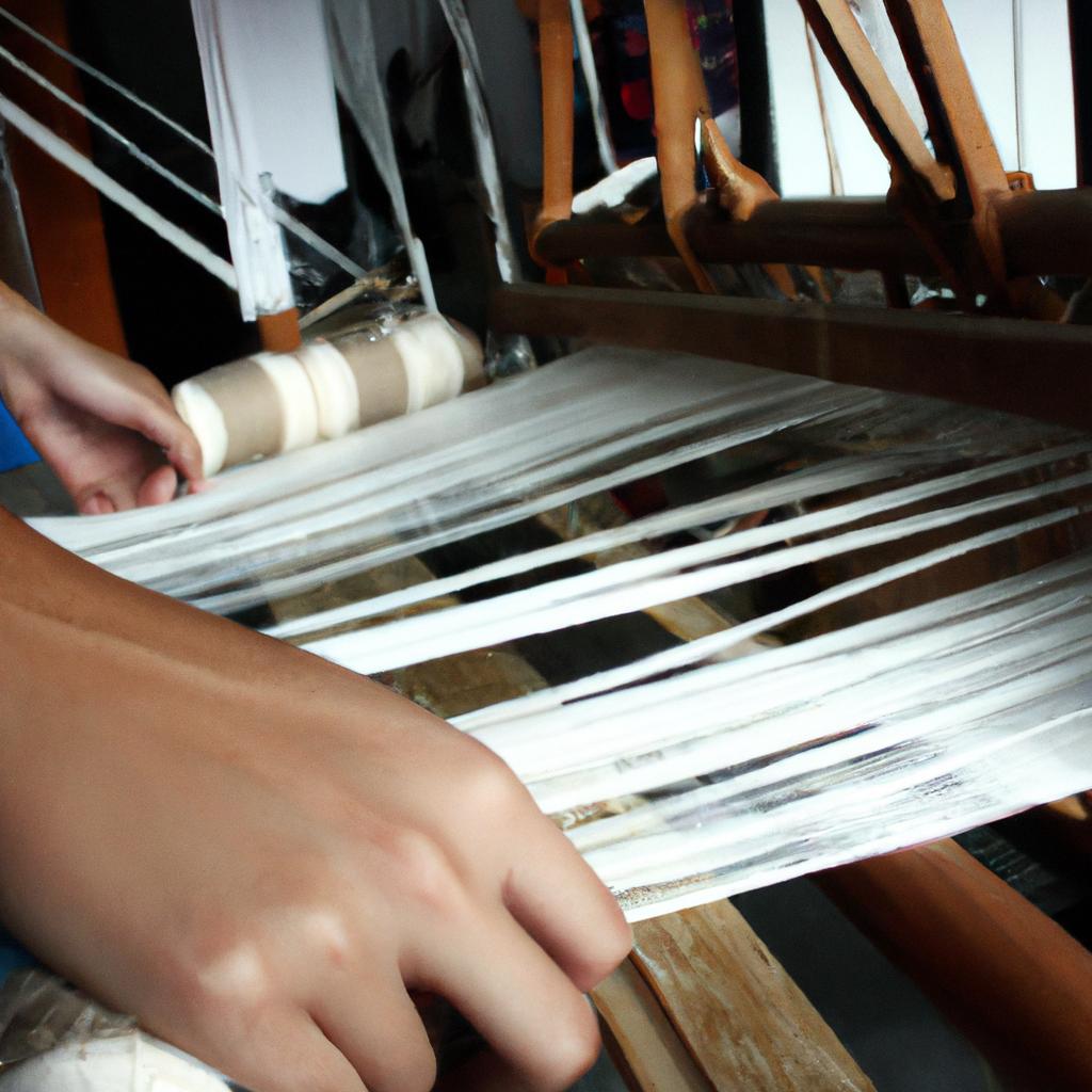 Person operating a weaving loom